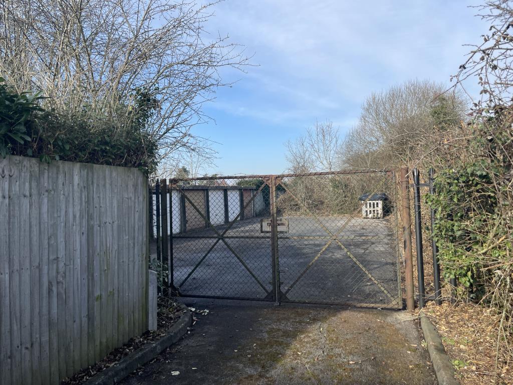 Lot: 61 - SEVEN GARAGES - view of entrance to garages in Marden